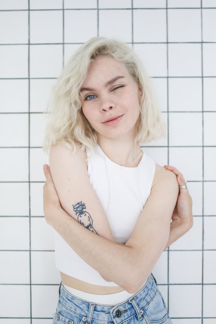 Girl In White Tank Top Winking