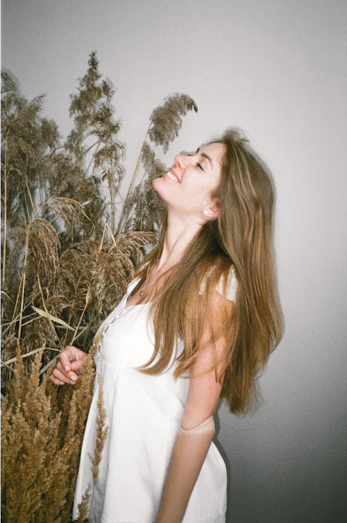 Person Standing Beside Dried Plants