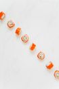 Orange and White Cookies on White Surface