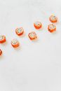 Orange and White Donuts on White Surface