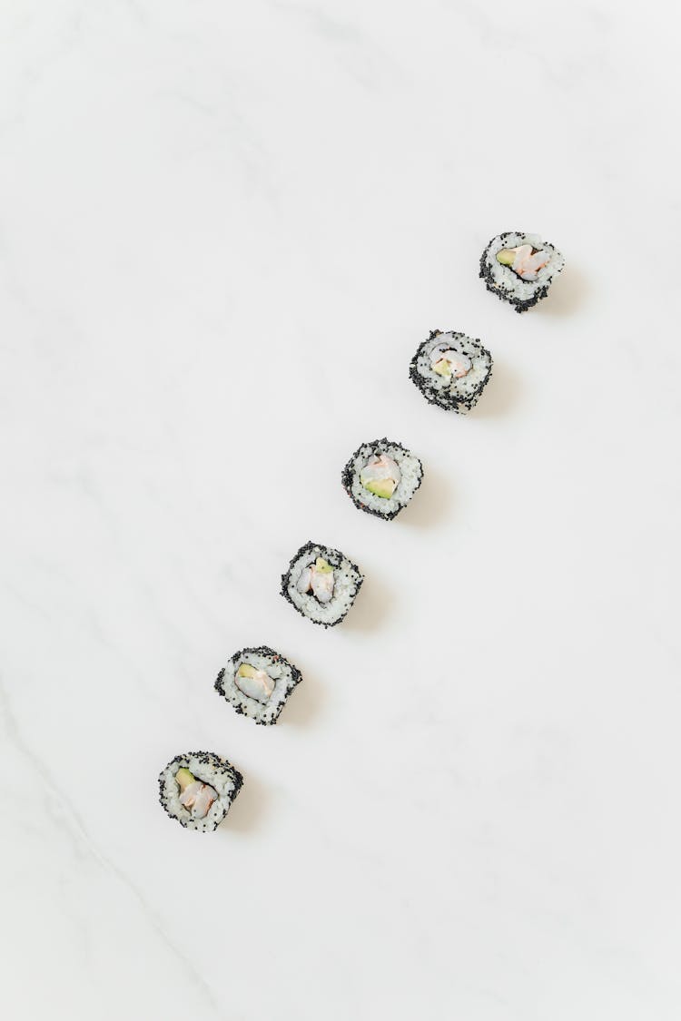 Sushi Rolls On A Marble Counter 