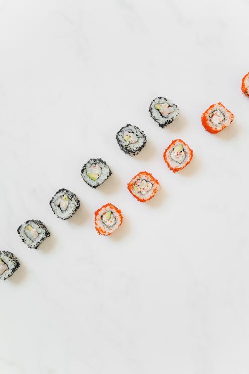 Sushi Rolls on White Surface