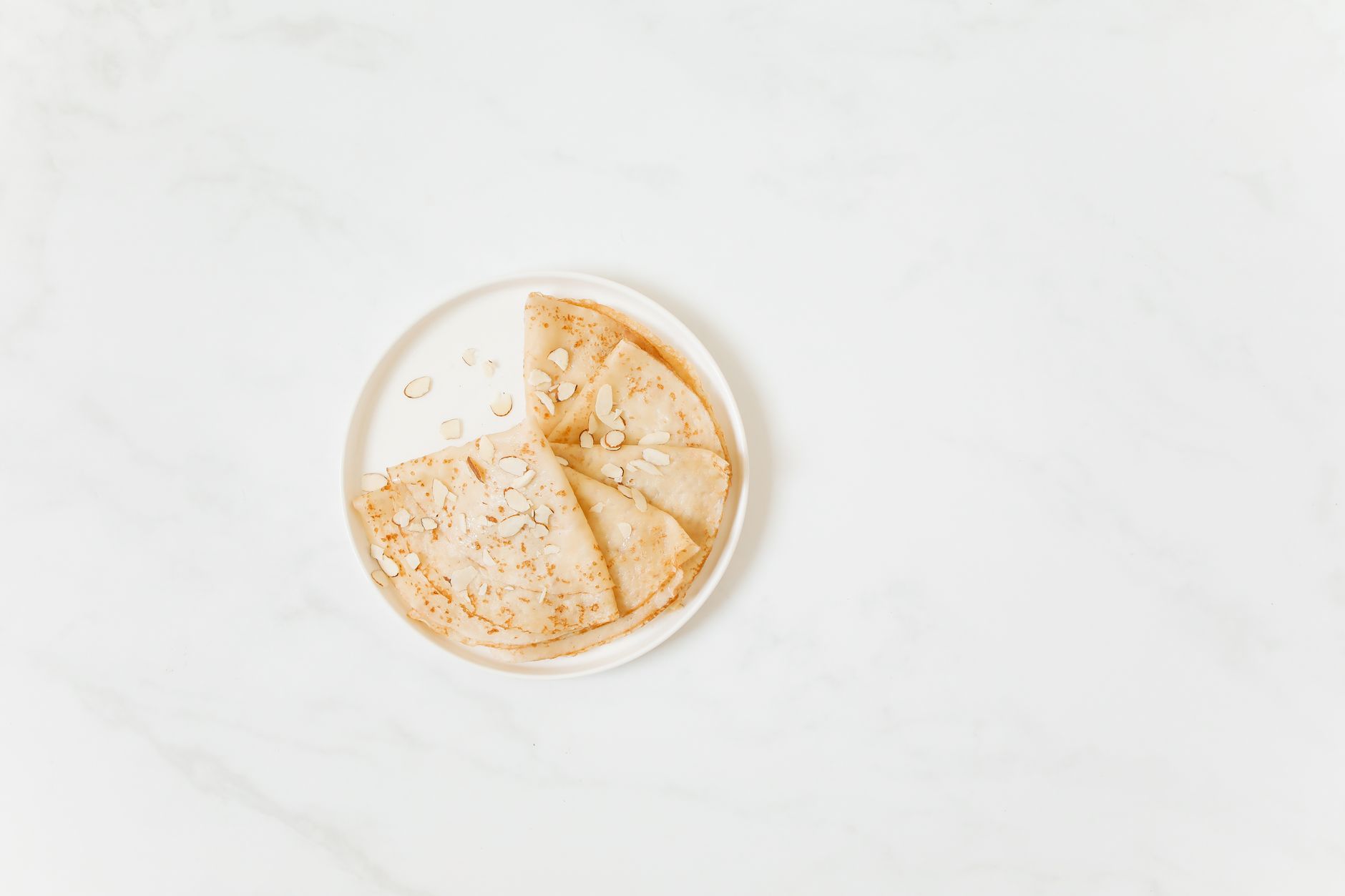 Freshly baked butter almond thins cooling on a rack