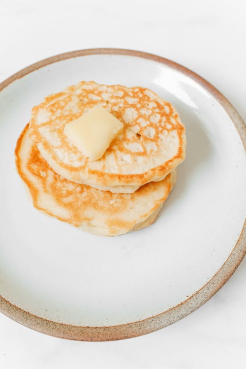 Free Photo of Pancakes With Butter on White Ceramic Plate Stock Photo