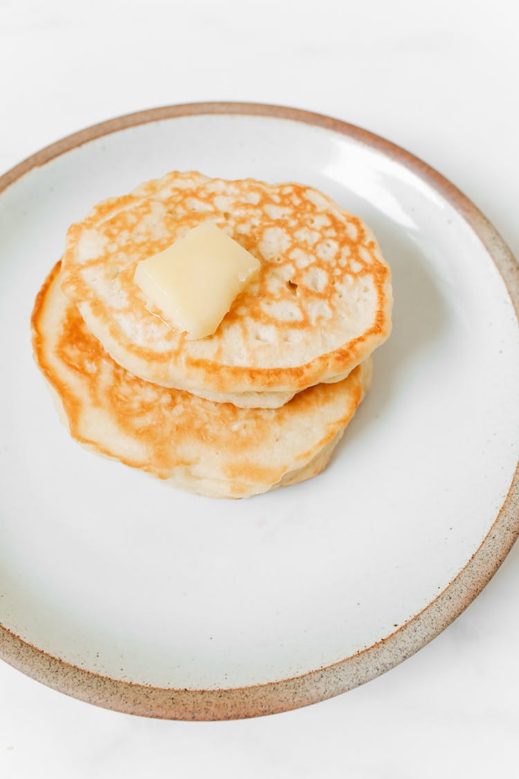 Photo Of Pancakes With Butter On White Ceramic Plate