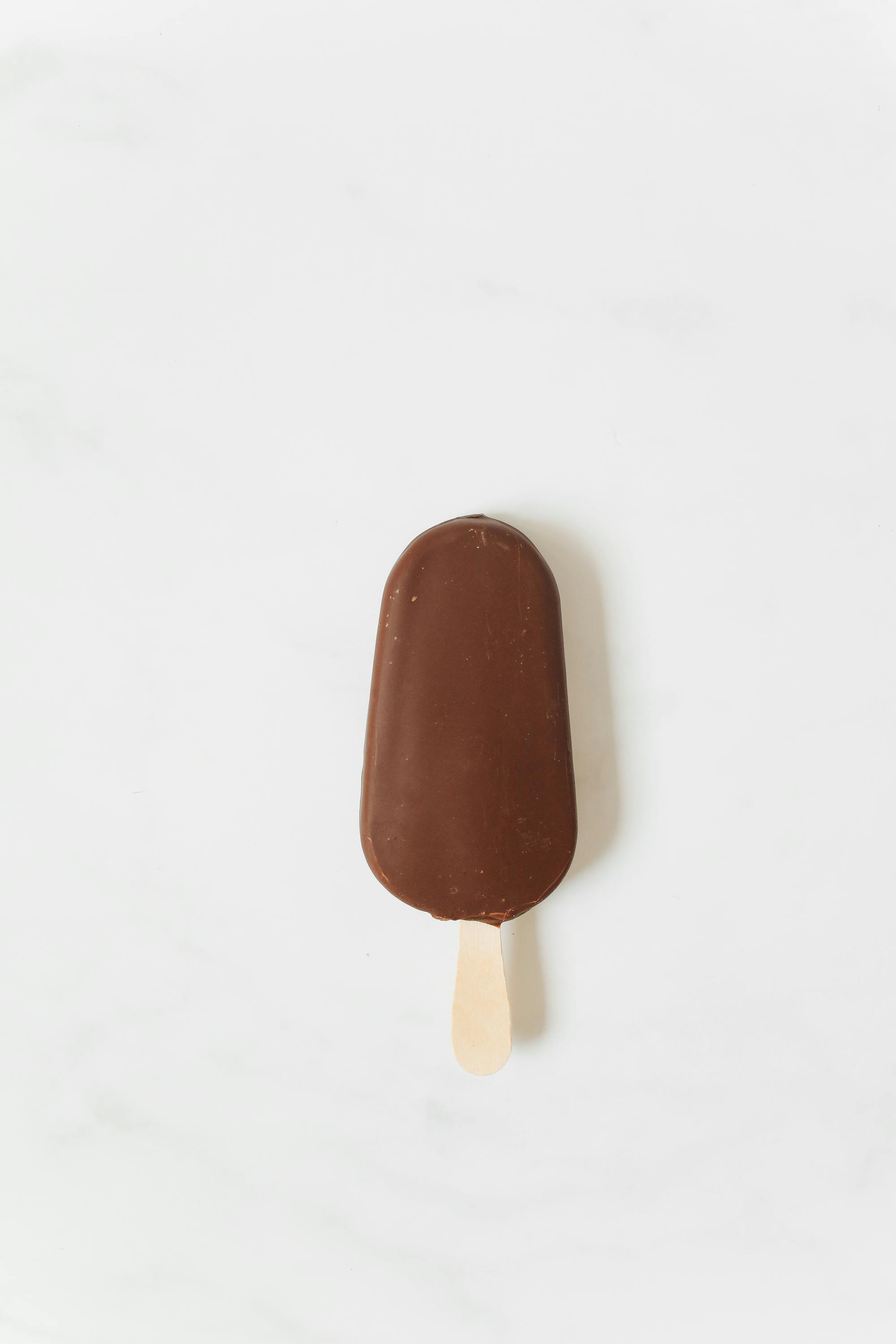 Chocolate Covered Ice Cream on Stick · Free Stock Photo