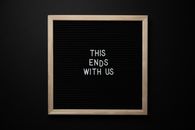 Black chalkboard with inscription on black background