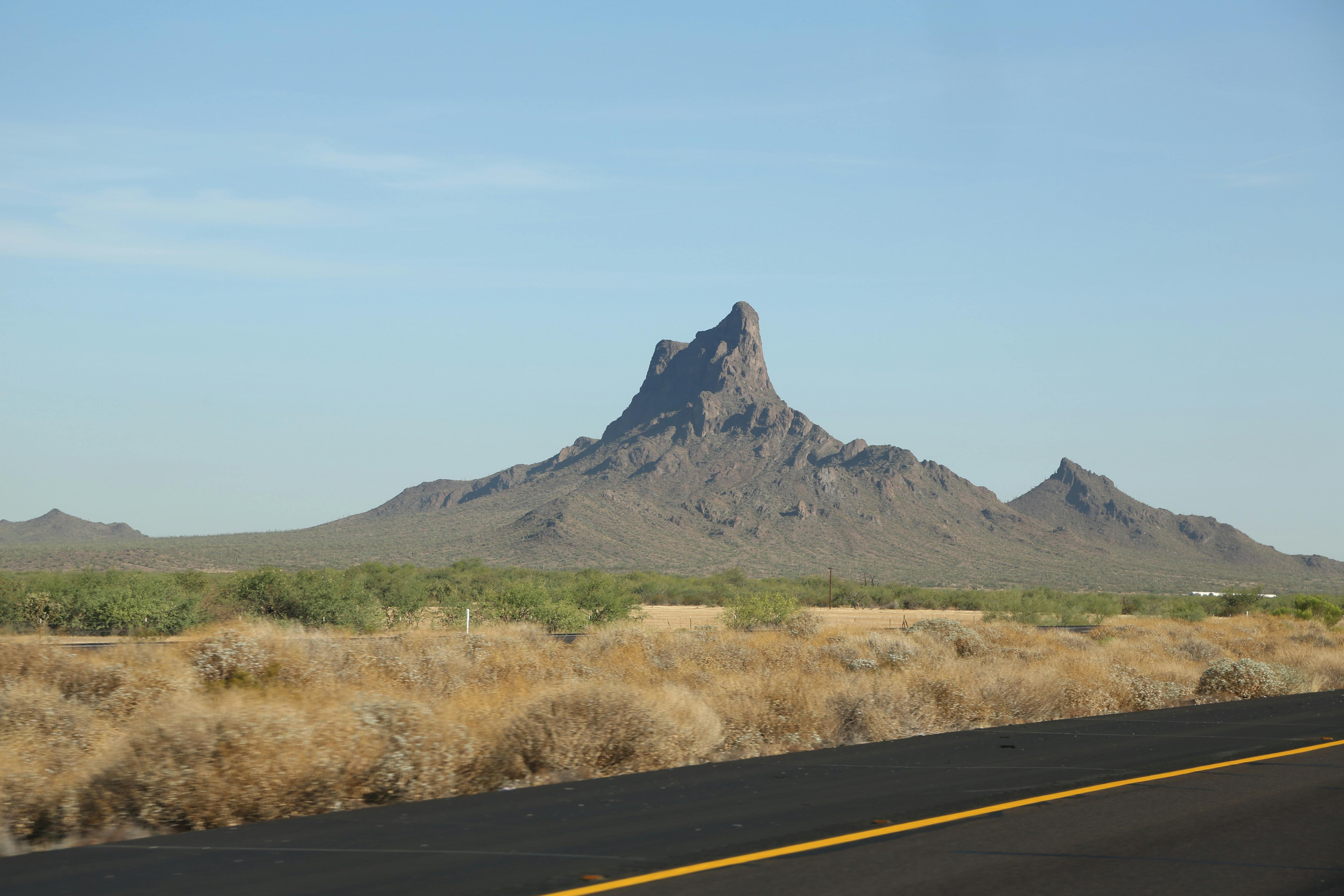 cloudless sky over lonely steep rock