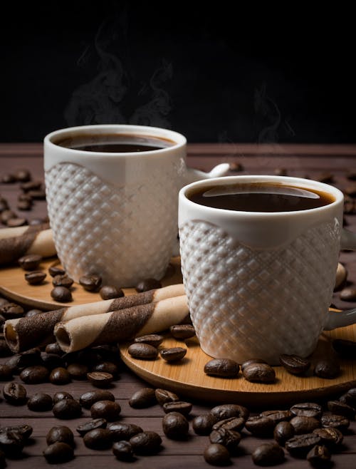 Free White Ceramic Mugs With Black Coffee on Brown Wooden Coaster Stock Photo