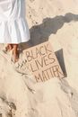 Black Lives Matter Text on Beach