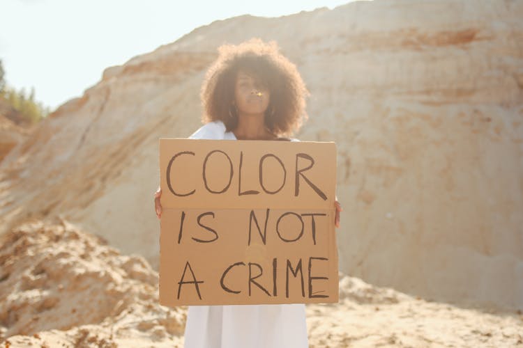 Woman Holding Sign