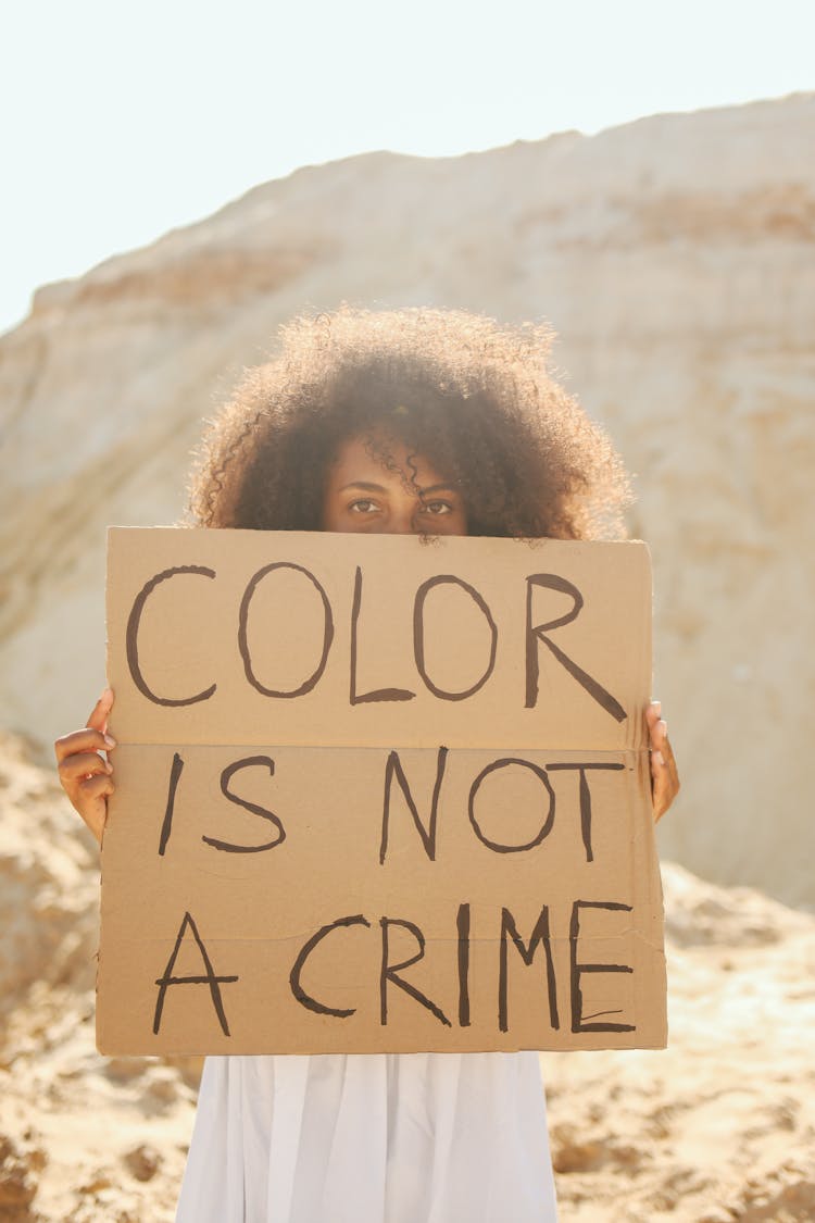 Woman Holding A Placard 