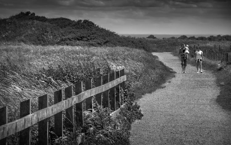 Couple With Baby On Footpath