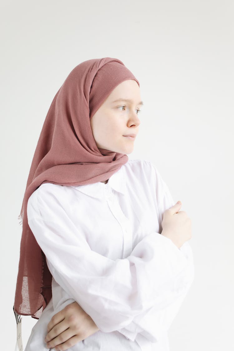 Woman In White Hijab And White Long Sleeve Dress