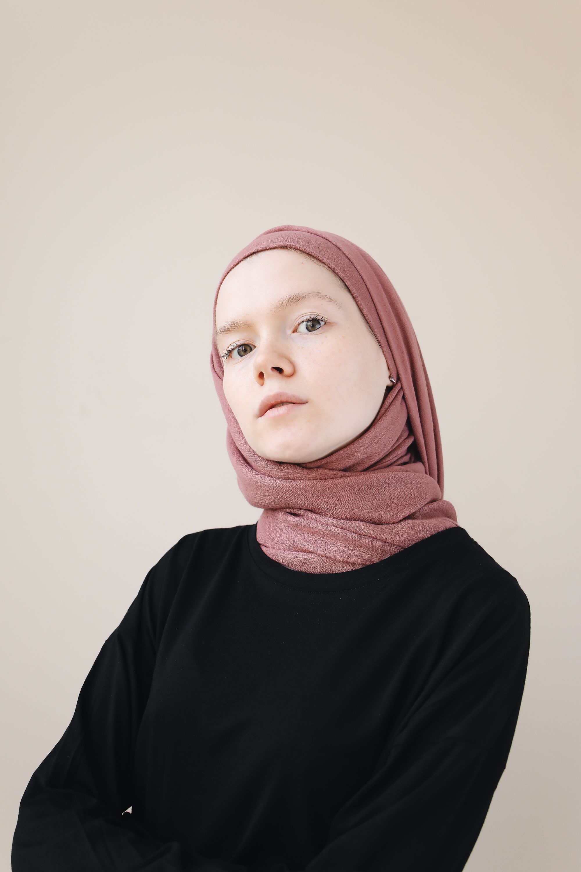 A Woman Wearing a Black Sweater and a Hijab · Free Stock Photo