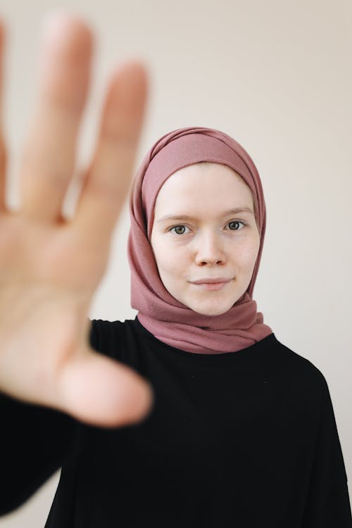 
A Woman Wearing a Black Sweater and a Hijab