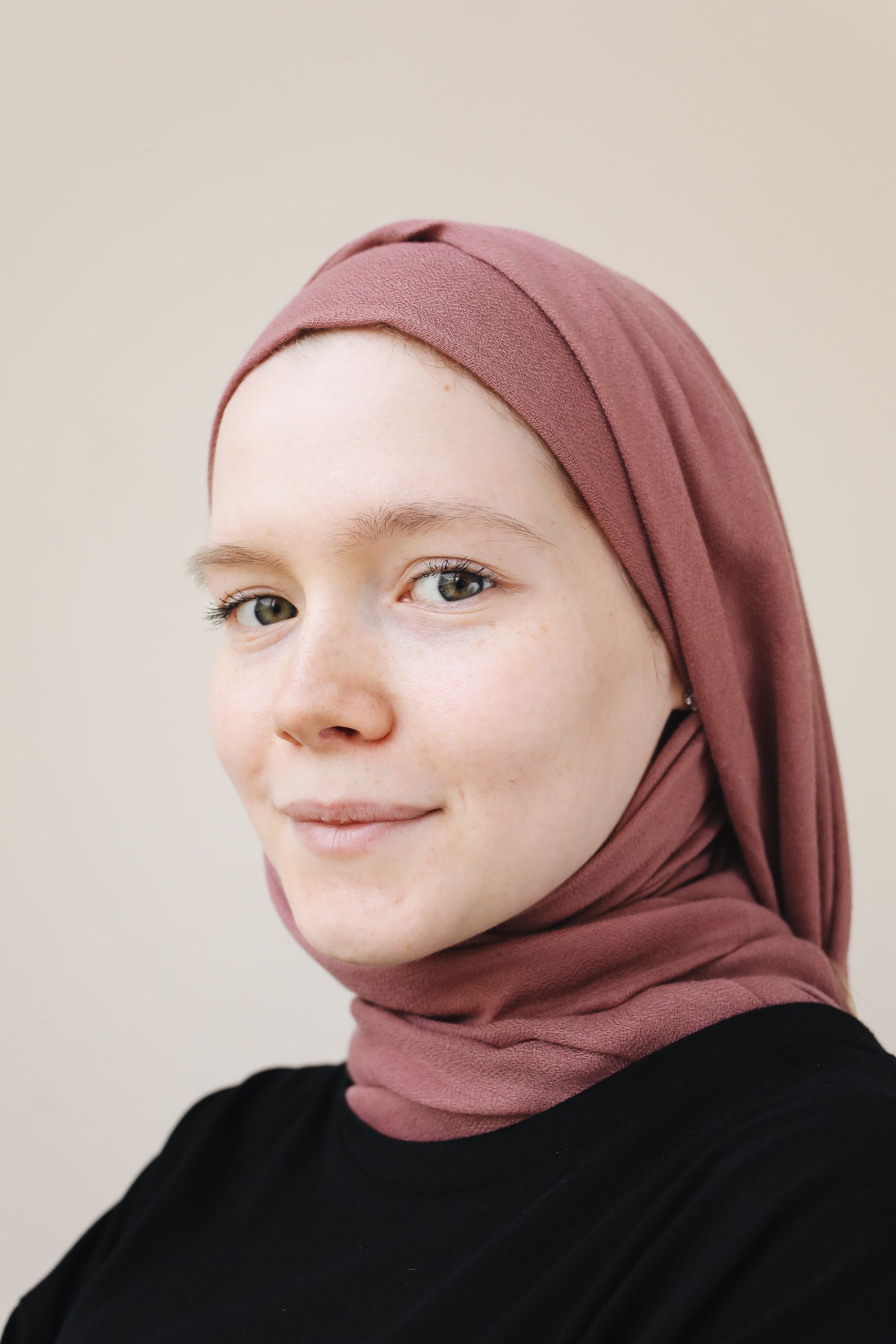 A Woman Wearing a Black Shirt and a Hijab · Free Stock Photo