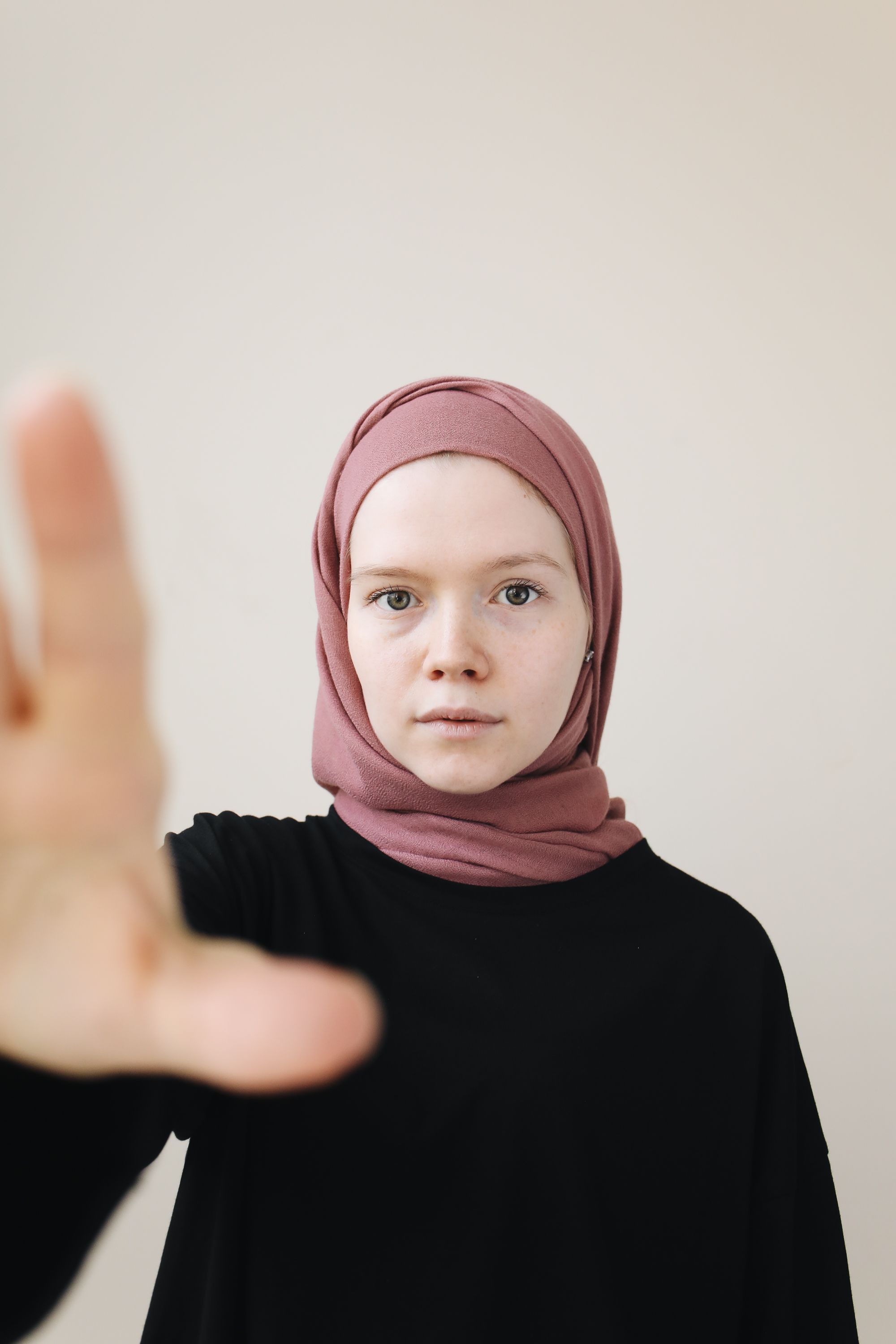 A Woman Wearing a Black Sweater and a Hijab · Free Stock Photo