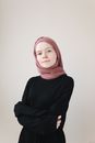 A Woman Wearing a Black Long Sleeved Shirt and a Hijab