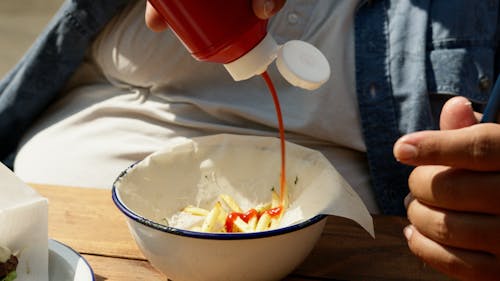 White Ceramic Bowl With White Plastic Spoon