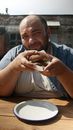 Man Holding Burger Smiling
