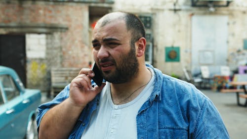 Free Bearded Man Talking on the Phone
 Stock Photo