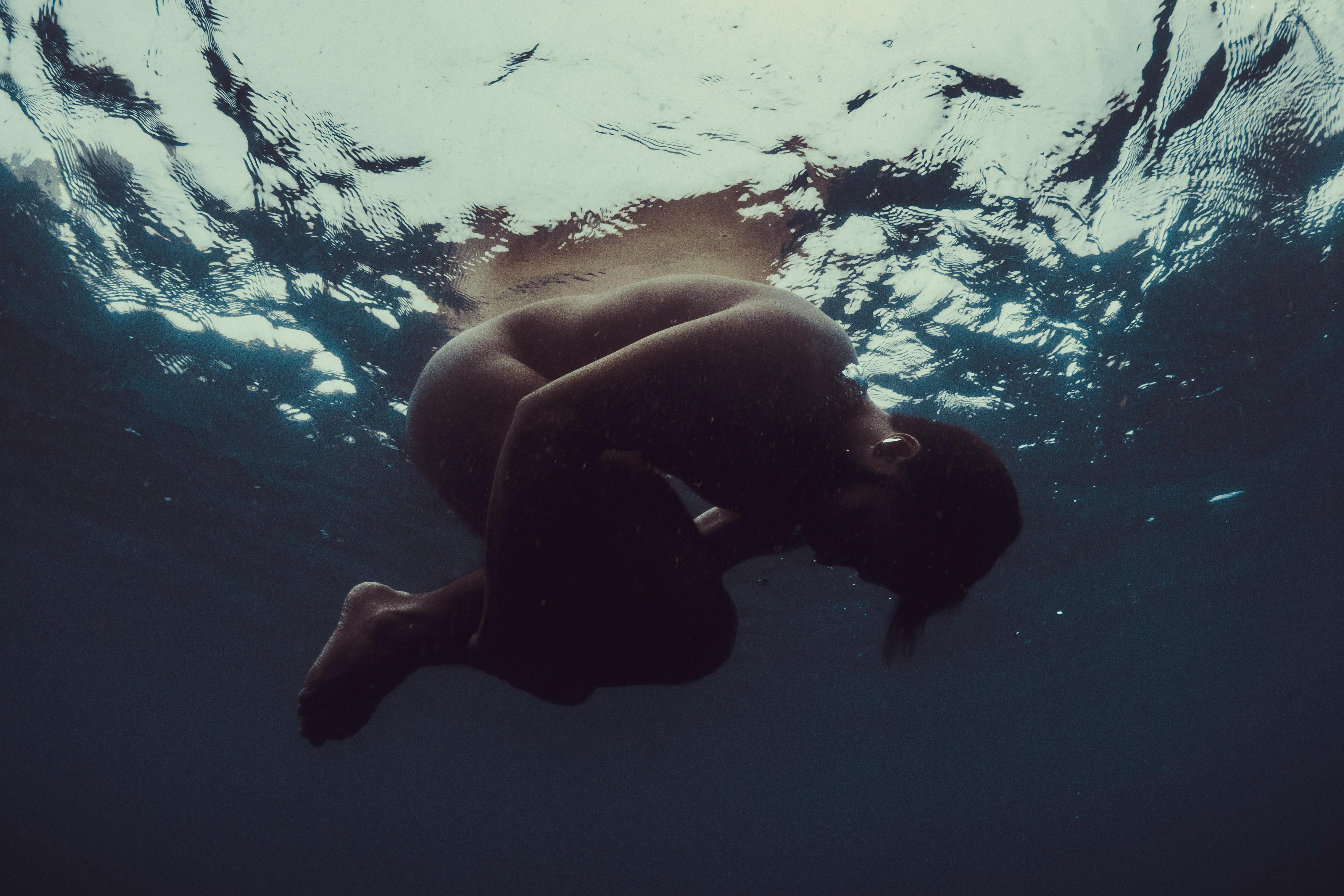 naked person underwater