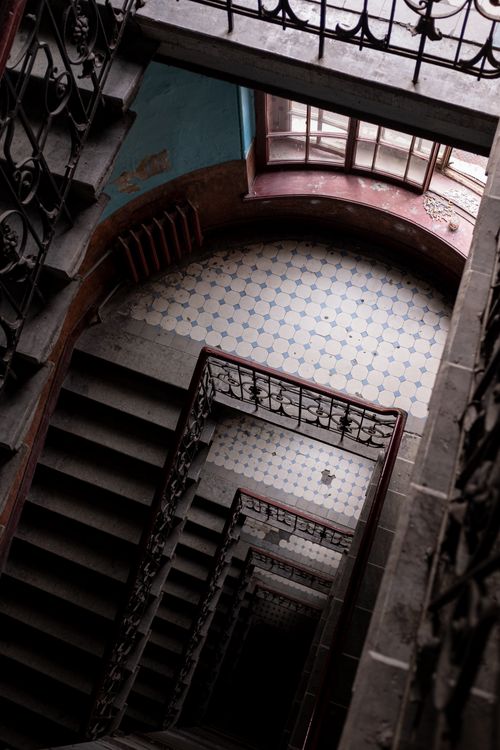 Free A vintage spiral staircase seen from above, showcasing ornate architecture. Stock Photo