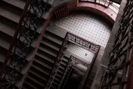 Brown Wooden Spiral Staircase With White Wall