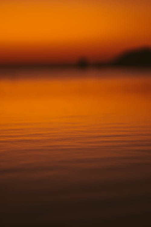 A Close-up Shot of a Body of Water during Sunset