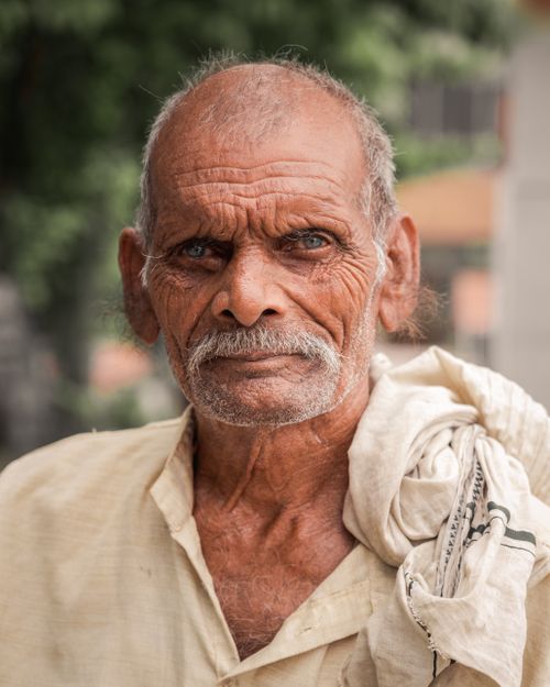 Free Close-up portrait of an elderly Indian man with a mustache, captured outdoors. Stock Photo