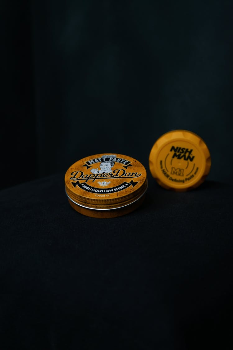 A Dapper Dan High Hold Low Shine Matt Paste And A Nish Man Products On Dark Background