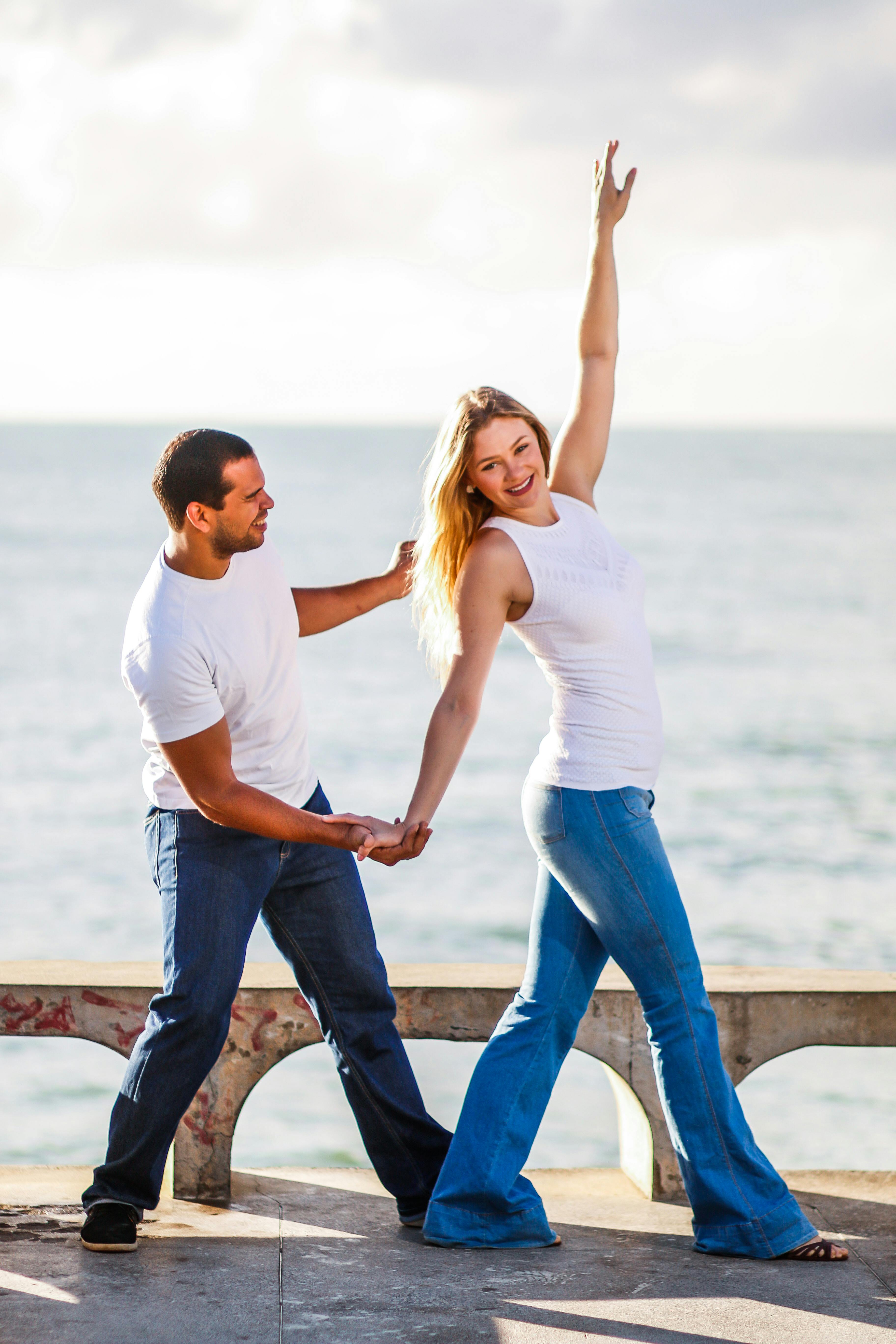 A Couple Dancing on Concrete Dock · Free Stock Photo