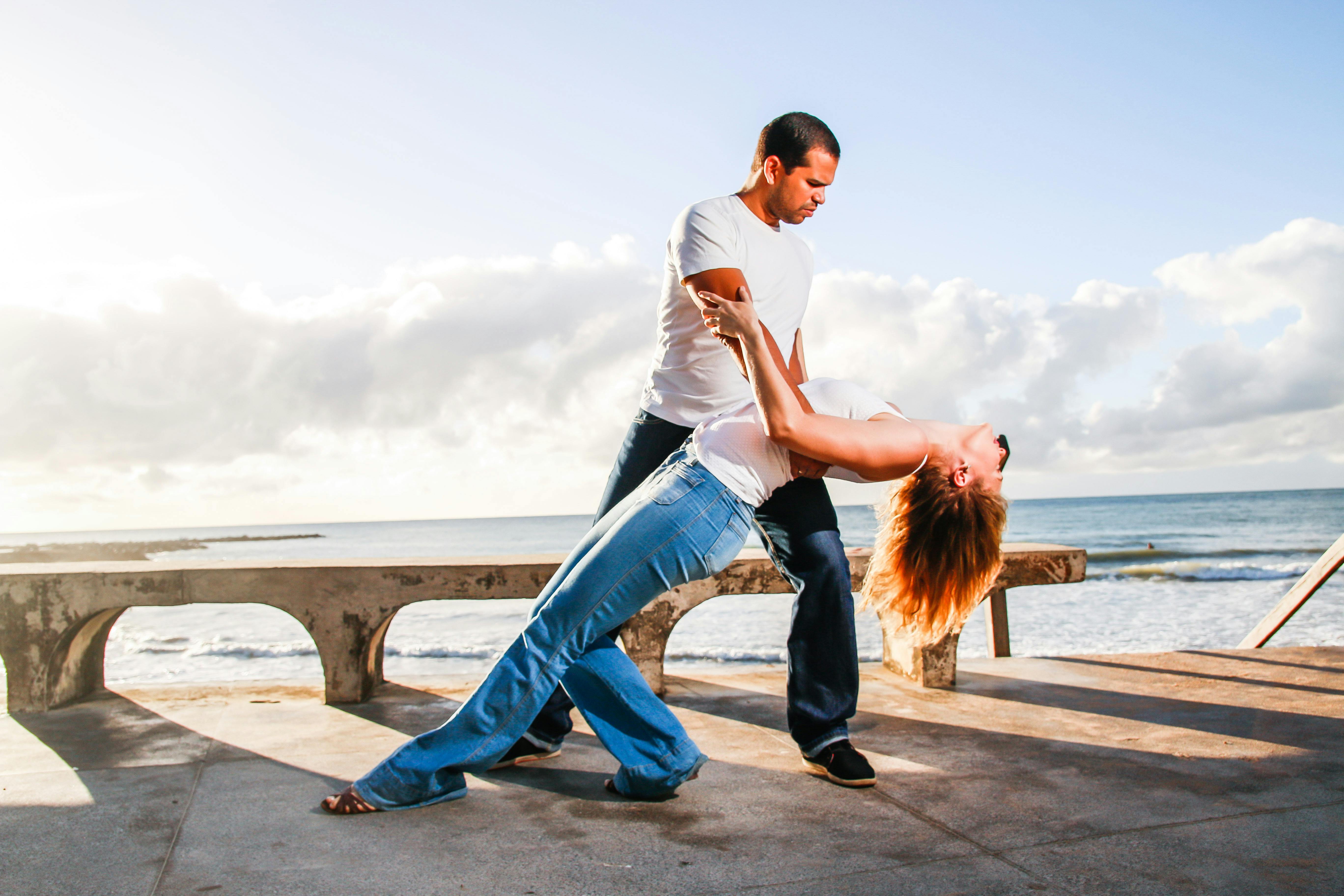 A Couple Dancing on Concrete Dock · Free Stock Photo