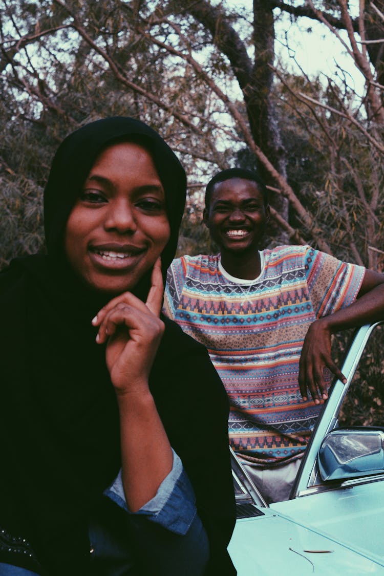 Smiling Black Couple Near Retro Car