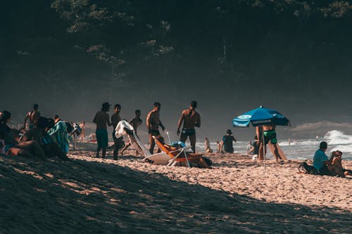 People Spending Time on Beach 