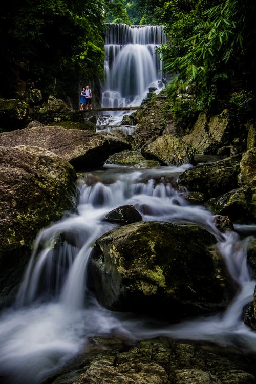 Free Stunning long exposure of a cascading waterfall in a verdant forest near Hà Nội, Vietnam. Stock Photo