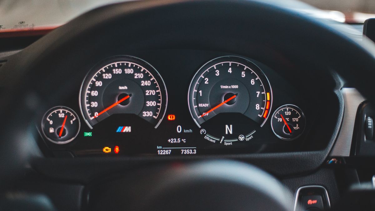 Dashboard with odometer speed control and fuel engine panel inside of sport car