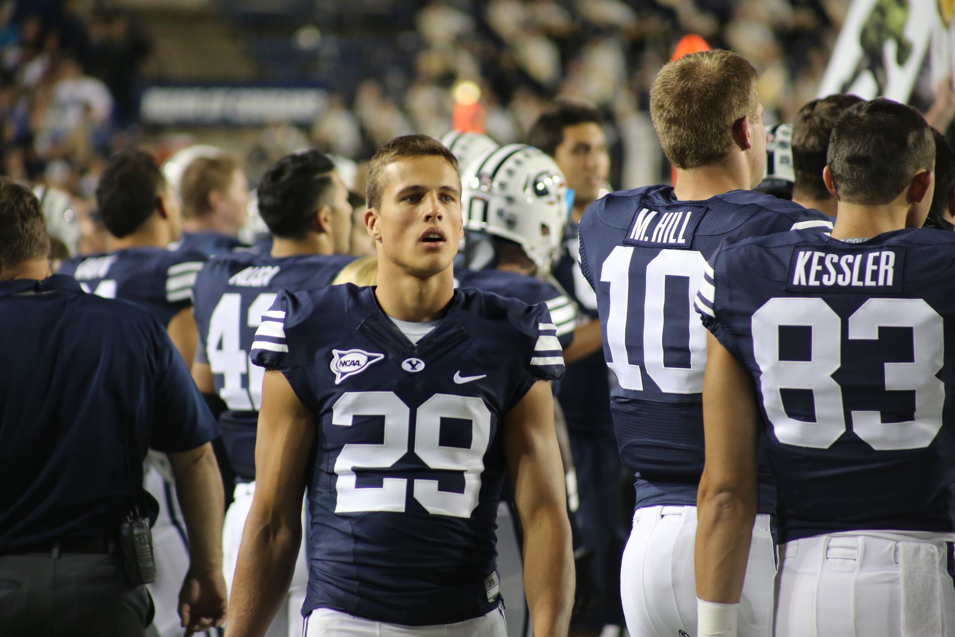 Man Walking Behind His Teammates