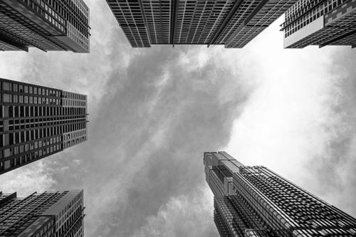 Free Low-angle view of skyscrapers in Ho Chi Minh City against a cloudy sky. Stock Photo