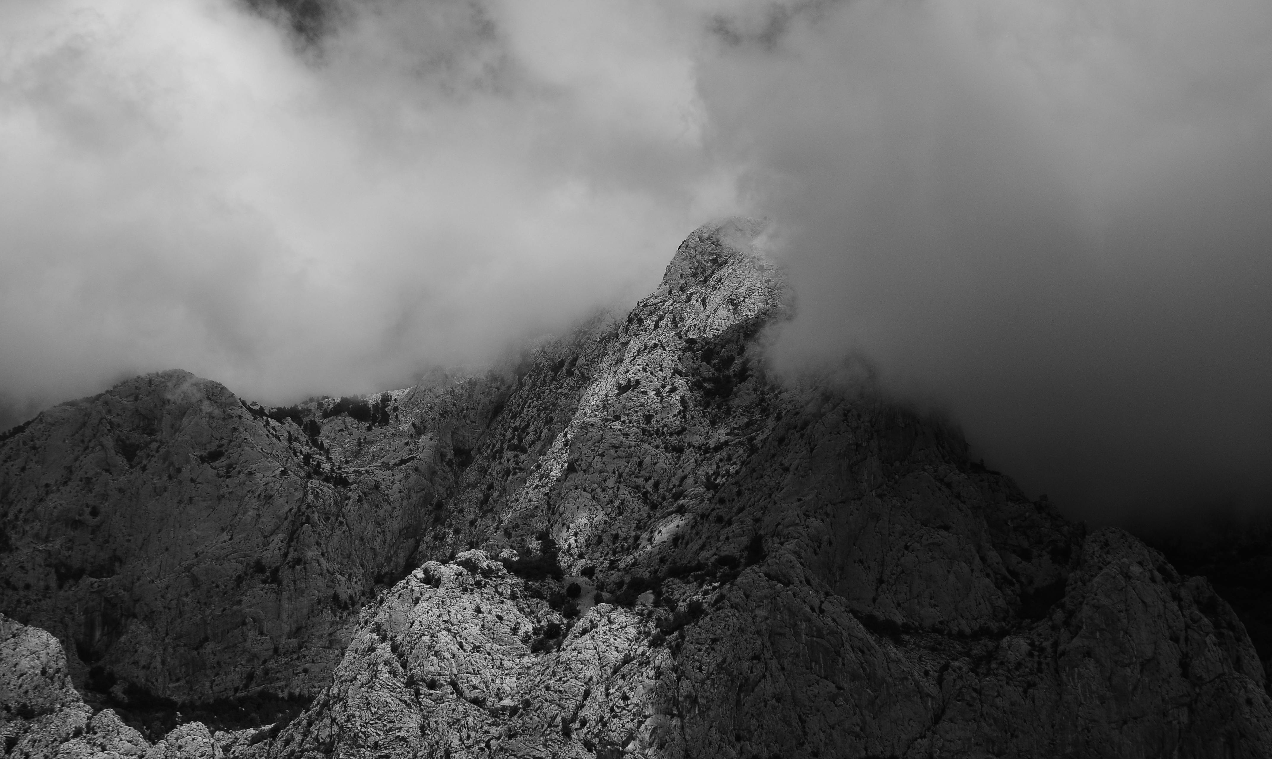 grayscale photo of a rocky mountain