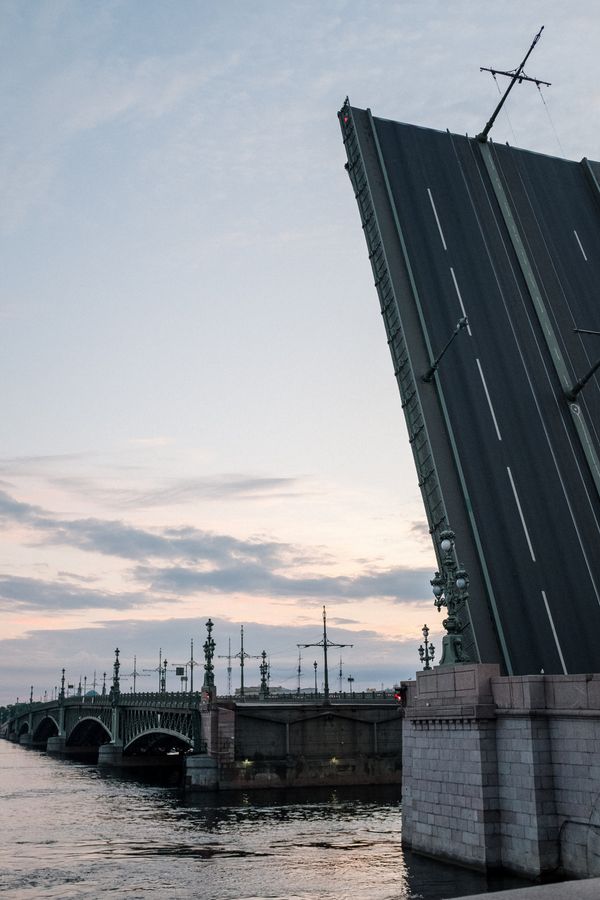 Palace Bridge raised over the Neva River at dusk in Saint Petersburg