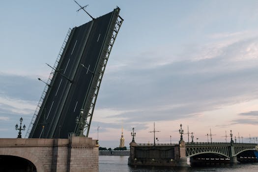 Palace Bridge raised over the Neva River at dusk in Saint Petersburg.