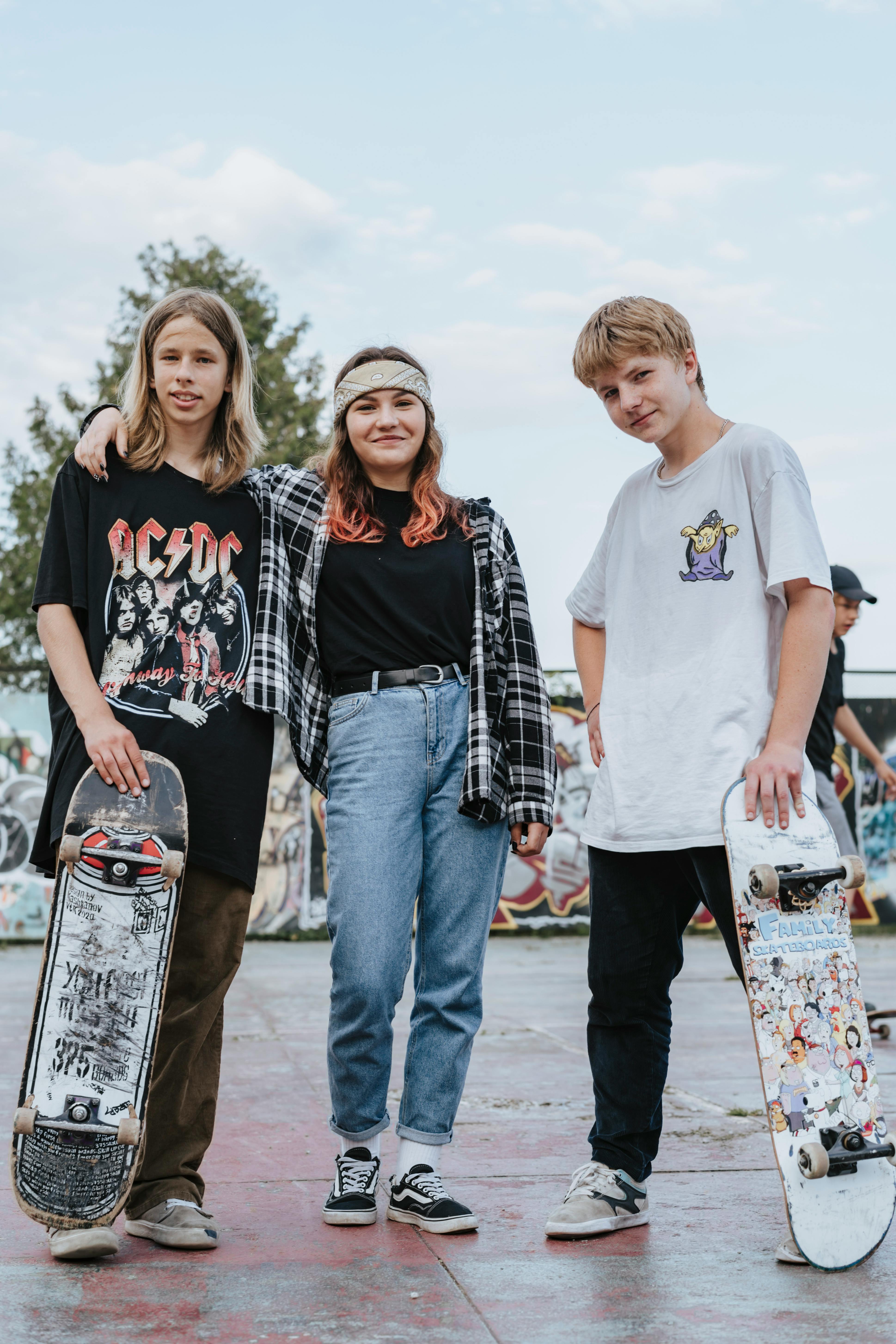 teenagers standing on concrete pavement