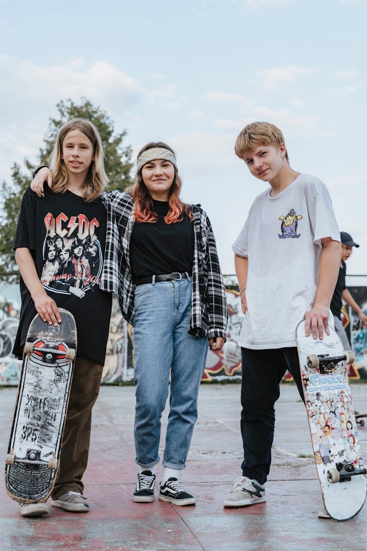 Teenagers Standing On Concrete Pavement