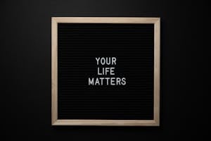 Blackboard with YOUR LIFE MATTERS inscription on black background