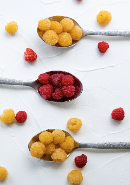 Close-Up Shot of Spoons with Raspberries