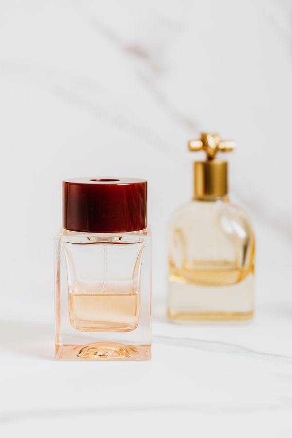 Perfume bottles on a marble surface — photo by Kaboompics on Pexels