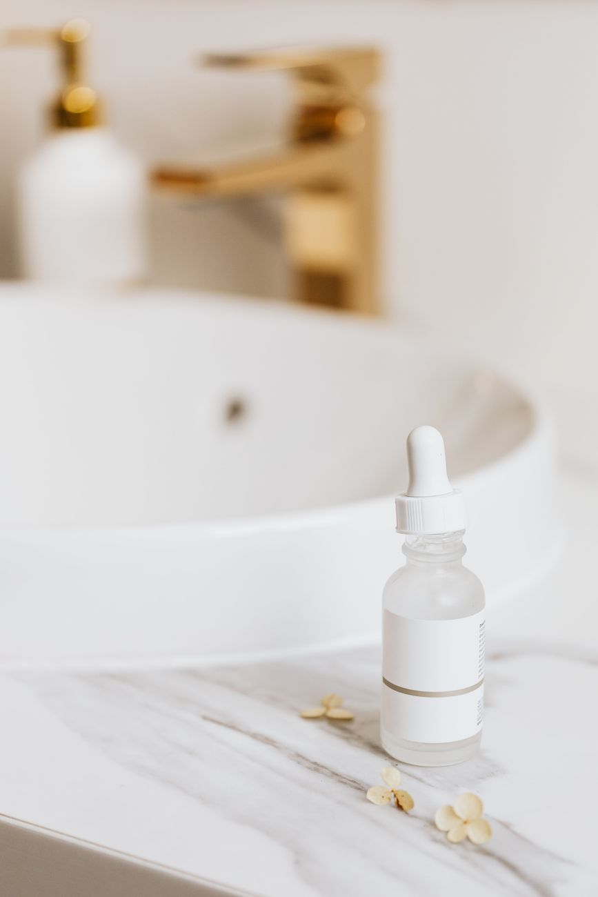A serum bottle on a vanity, close enough to suggest the ingredient-level scrutiny shoppers now bring to beauty buys.