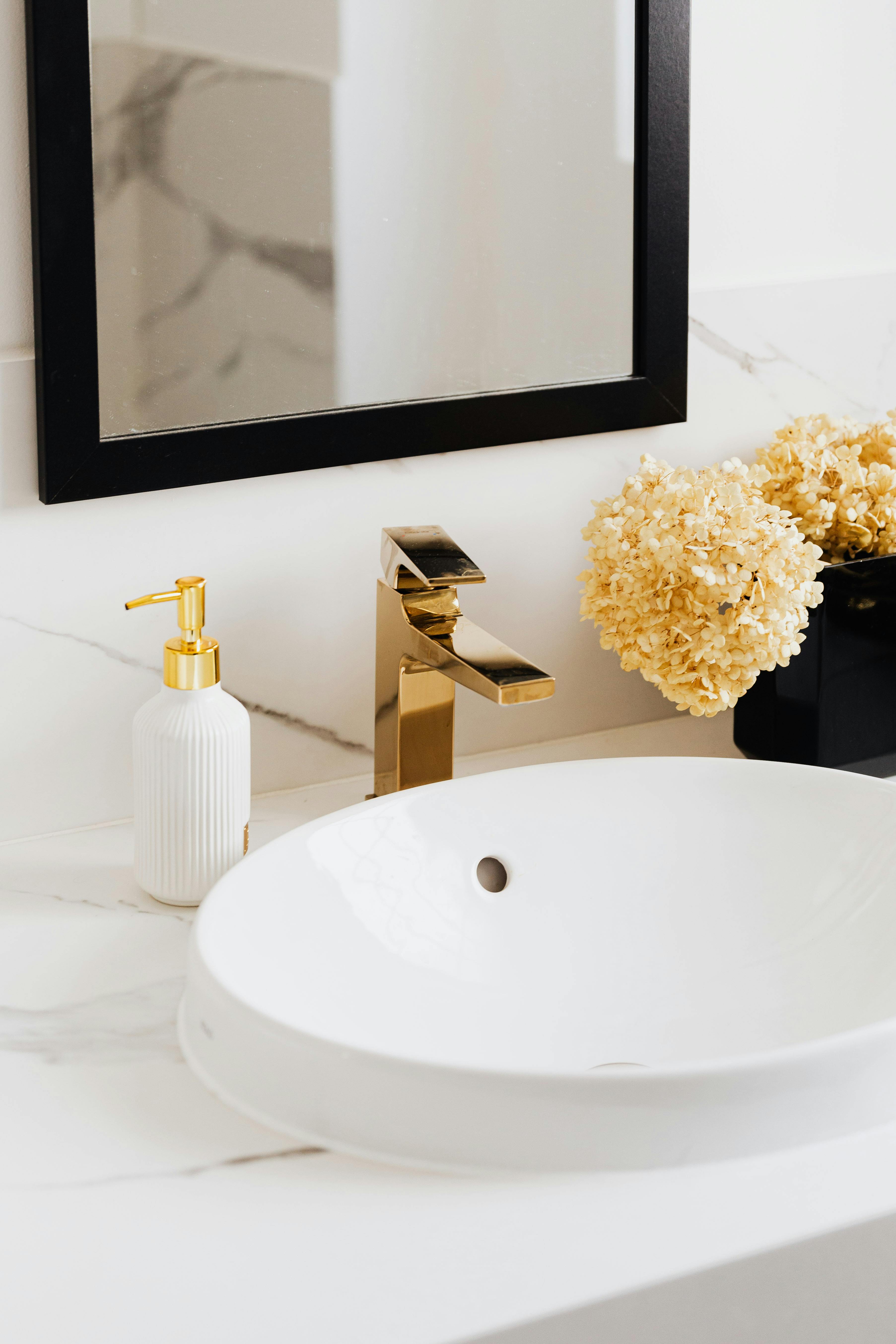 white ceramic sink with faucet